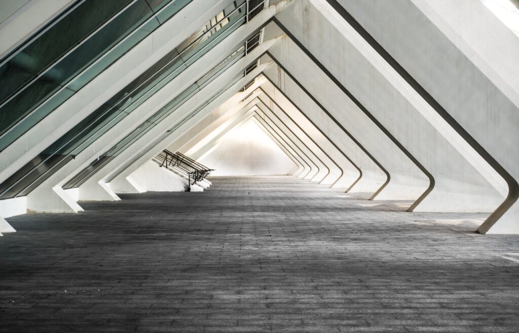 pexels-photo-1633970 Explore a sleek and contemporary architectural hallway with futuristic design.