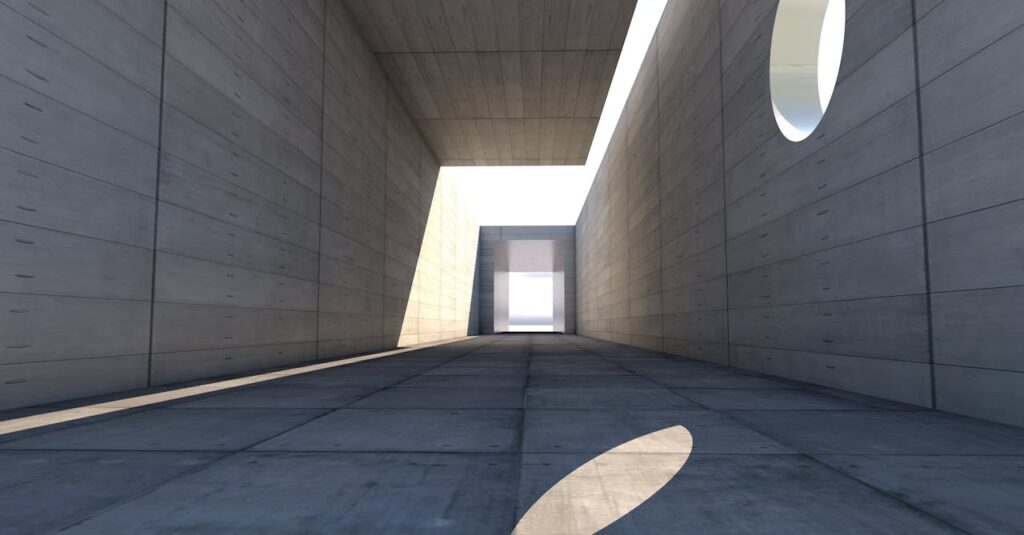 pexels-photo-327482 Concrete passage showcasing modern architecture with dramatic light and shadow play.